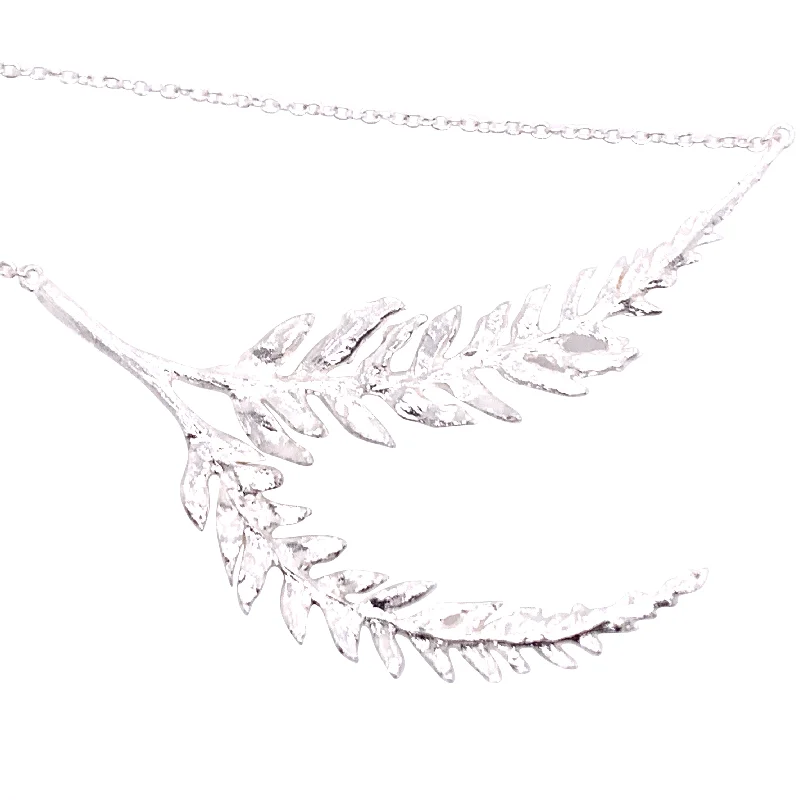 Women's gold necklaces-Textured silver necklace made with real leaves.