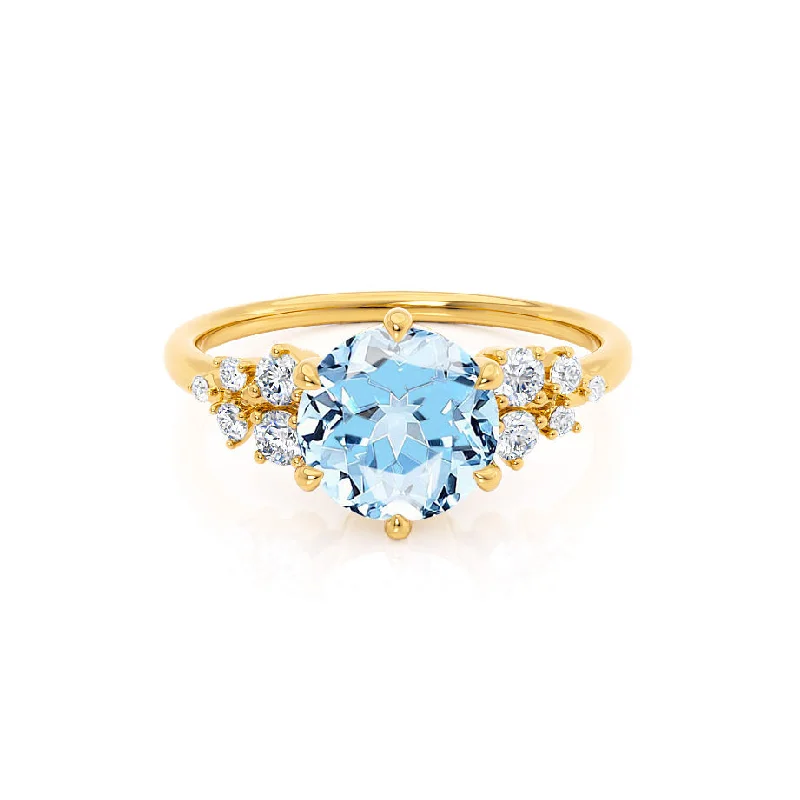 Designer women's rings-ALYA - Chatham® Round Aqua Spinel Starburst Cluster Shoulder Set Engagement Ring 18k Yellow Gold