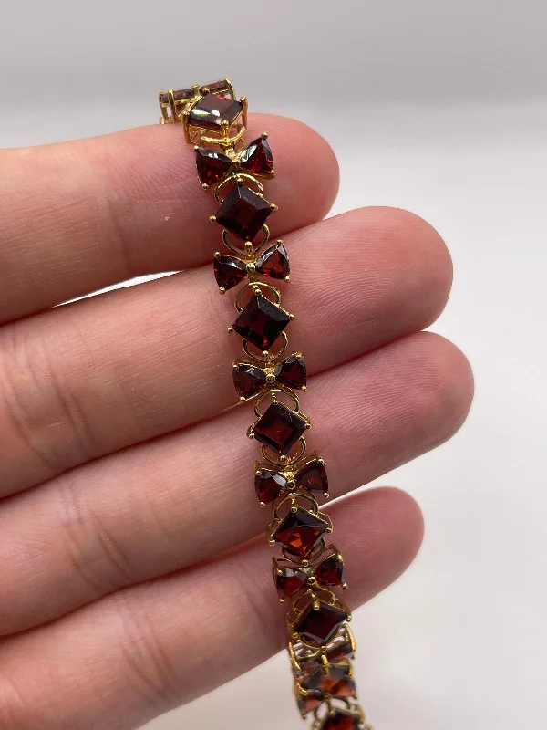 Women's titanium bangles-9ct gold garnet bracelet